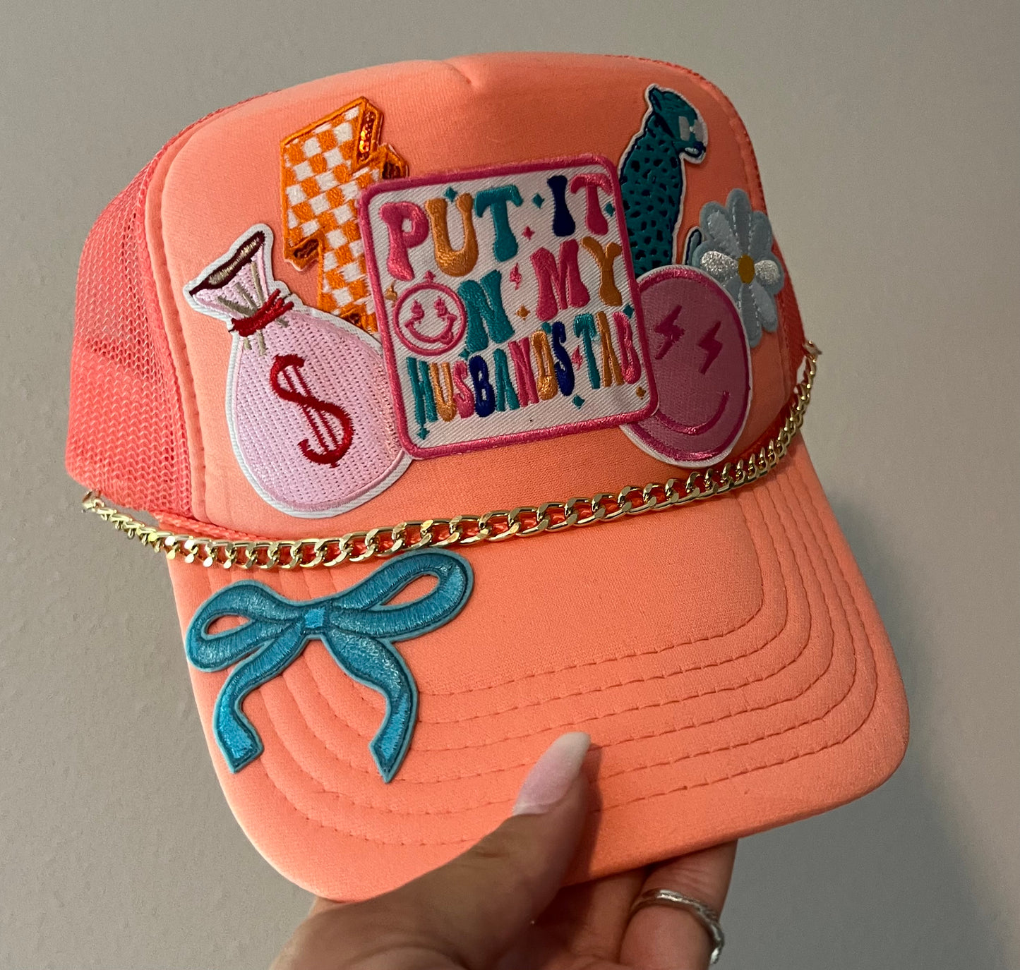 Put it in my husbands tab patch hat